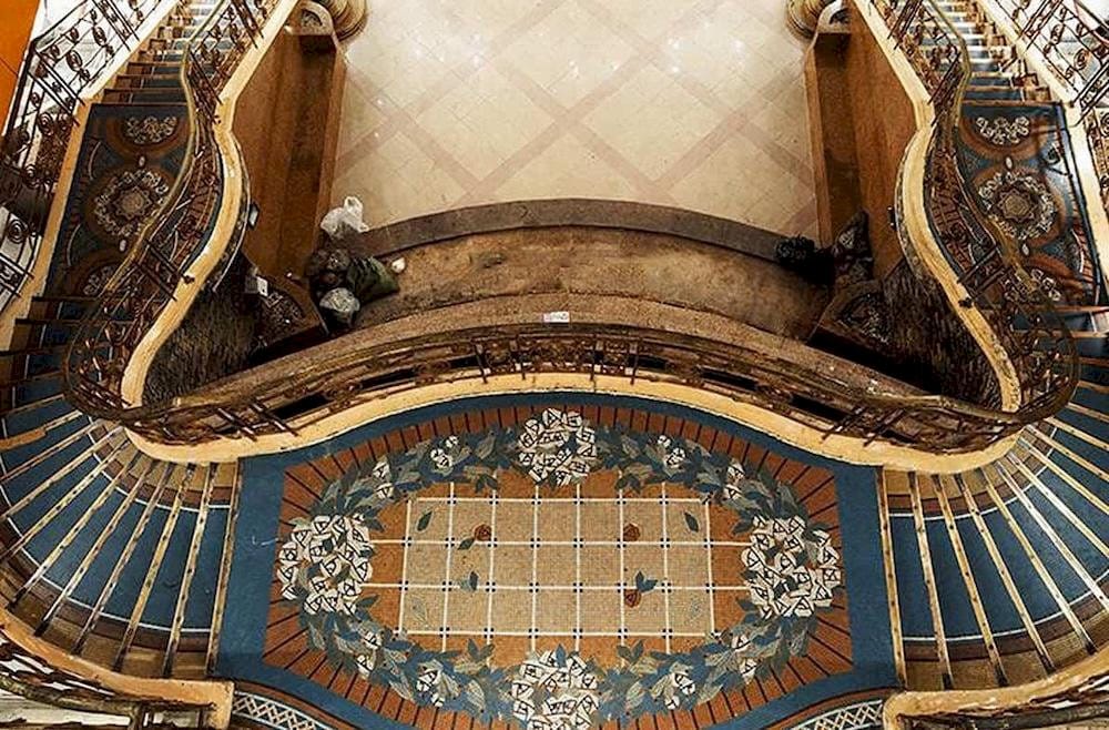 The spiral staircase at the museum stands out with its intricate carvings on the railing, beautifully preserved over time